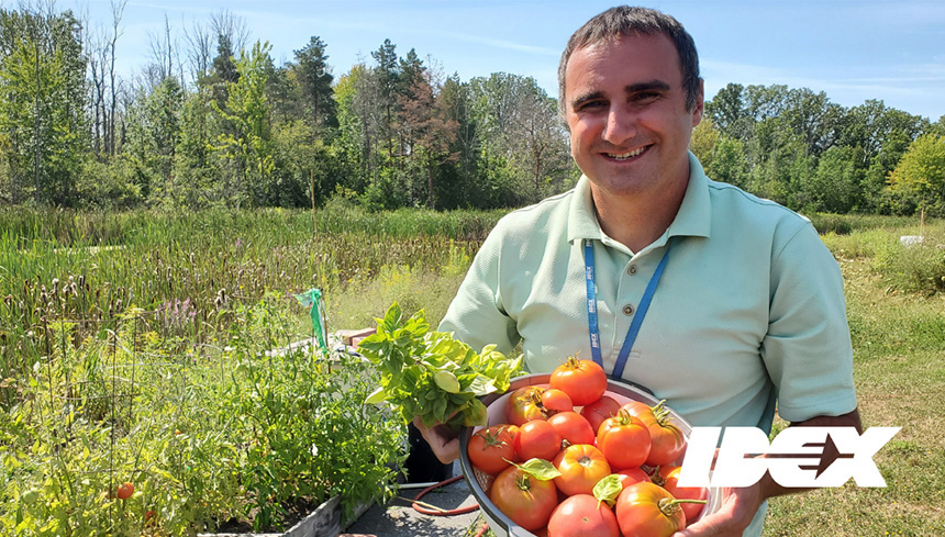 Nick holds basket of tomatoes