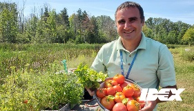 Nick holds basket of tomatoes