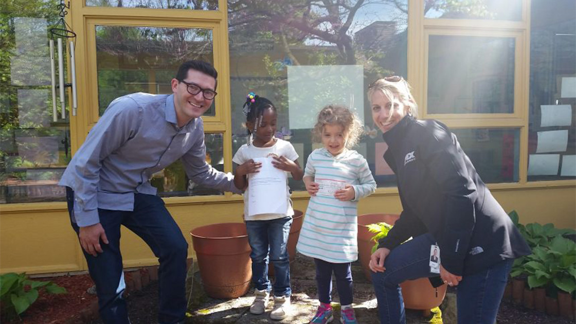2 IDEX Health & Science volunteers with 2 youth at RCN