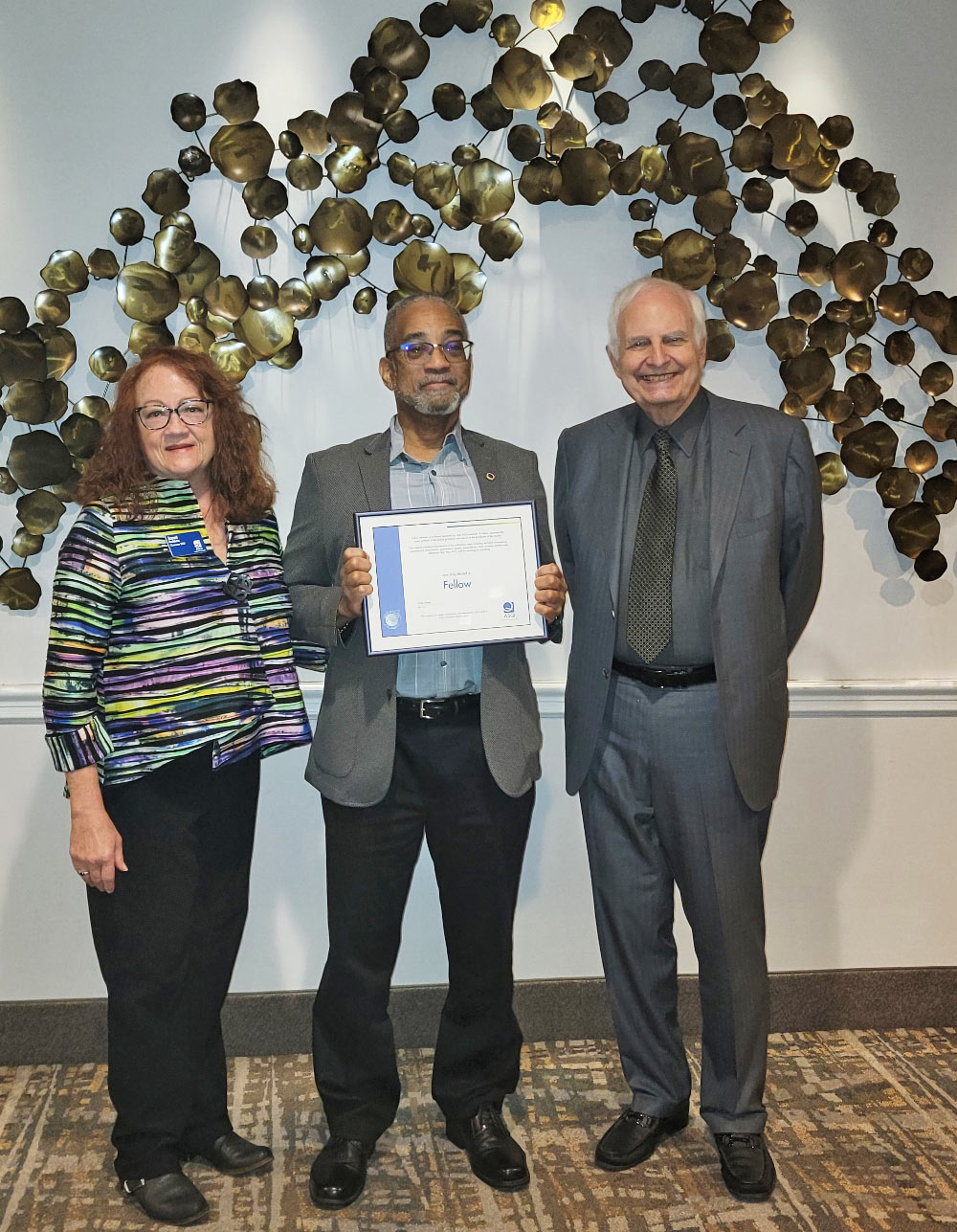 Lance B Coleman holding ASQ Fellow Award