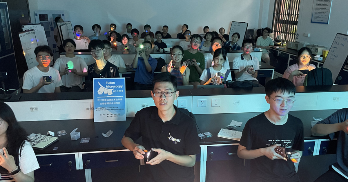 group of students holding optical filters